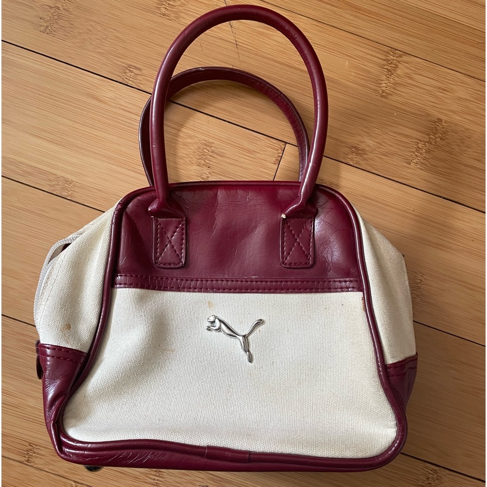 Puma hand carry bag. Deep red synthetic leather.